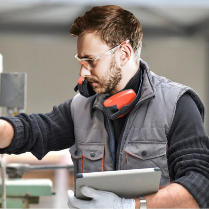 impact safety glasses worn with industrial workwear and tablet