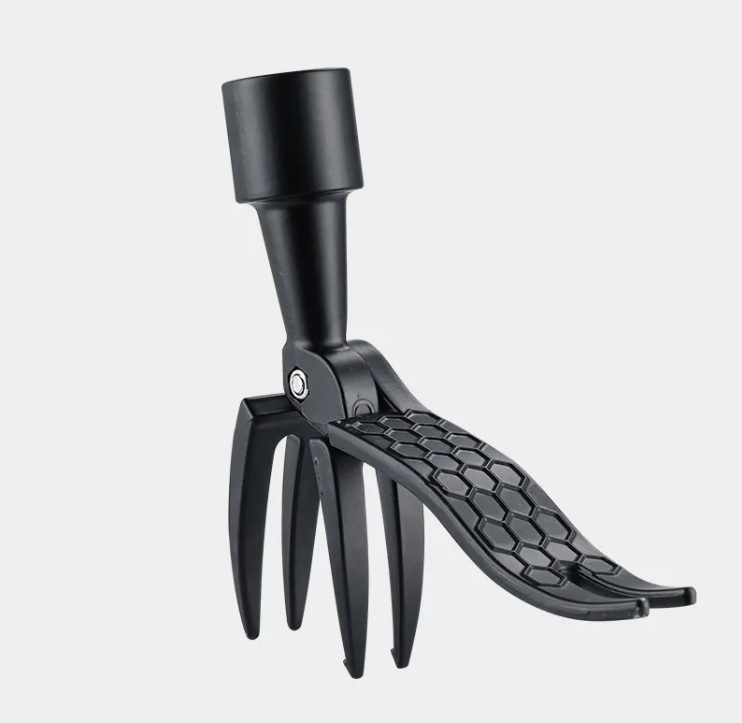 Stand-up weeder & root remover tool foot pedal driving claw into soil