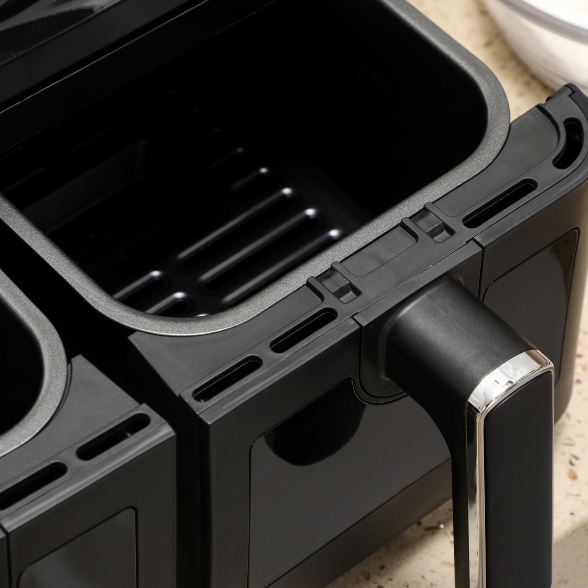 dual-zone air fryer non-stick basket detail