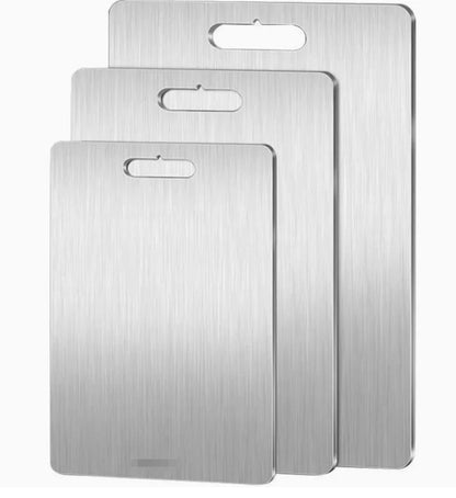 A rectangular titanium cutting board with a handle, displaying dimensions and weight.
